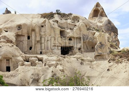Old Ancient Temple And Residential Caves Carved Into The Sandstone Mountains In Cappadocia