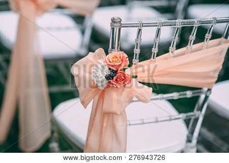 Square Wedding Ceremony. Transparent Chairs Are Decorated With Flowers, Greenery. Cute, Trendy Svdeb