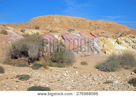 Colored sands in the Makhtesh Gadol erosion crater in the desert in Israel