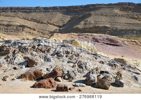 Colored sands in the Makhtesh Gadol erosion crater in the desert in Israel