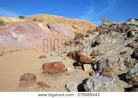 Colored sands in the Makhtesh Gadol erosion crater in the desert in Israel