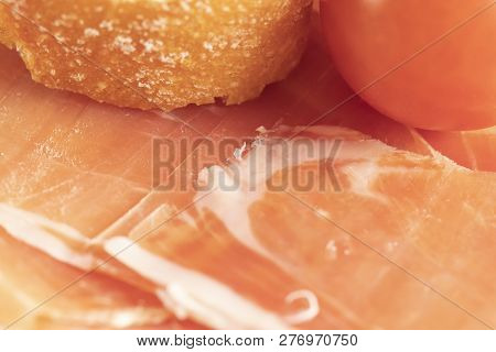 Spanish Ham In Dry Form, Jamon Serrano, Bello, Italian Ham, Chopped Layers With Bread And Cherry Tom