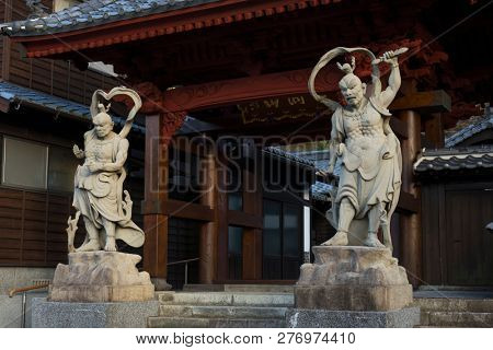 Arita, Japan - October 30, 2018: Two wooden nio statues protecting the Tozan temple in Arita