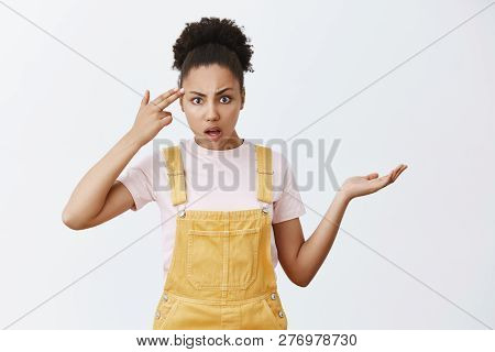 Are You Insane Or Dumb. Portrait Of Displeased Pissed And Annoyed Questioned Female With Dark Skin, 