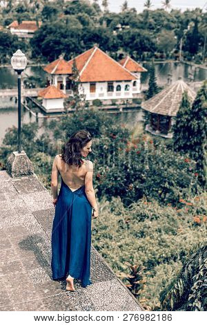 Bali, Indonesia - December 29, 2018: Young Woman At Taman Ujung Water Palace.