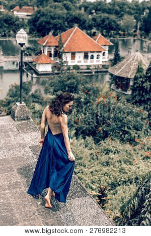 Bali, Indonesia - December 29, 2018: Young Woman At Taman Ujung Water Palace.