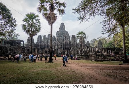 angkor thom, cambodia - november 28, 2018: bayon temple with 54 towers, each displaying 4 smiling faces of the bodhisattva avalokiteshvara.