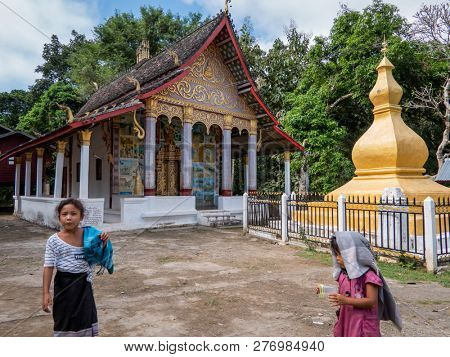 ban boe bak baw, laos - november 19, 2018: 600 year old mountain village on the banks of the mekong. minorities of the shan live here.