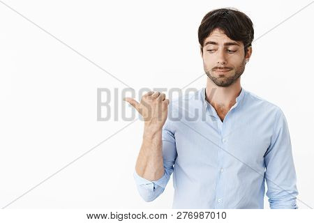 Do Not Want Point Fingers And Blame But Look. Portrait Of Awkward Ashamed And Intense Good-looking Y