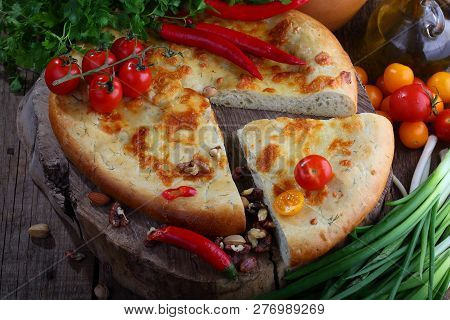 Megrelian Khachapuri On A Wooden Table. Open Pie With Egg And Cheese