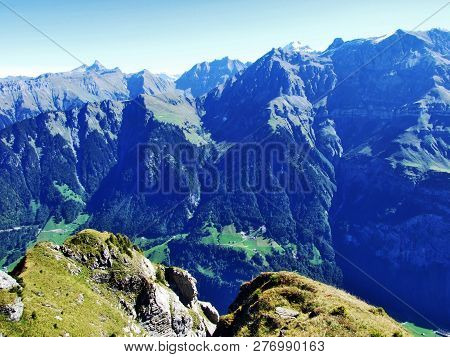 A View Of The Steep Slopes Of The Mountain And The Top Of Nuschenstock In The Mountain Range Glarus 