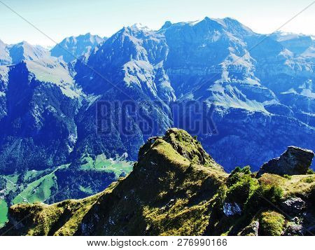 A View Of The Steep Slopes Of The Mountain And The Top Of Nuschenstock In The Mountain Range Glarus 