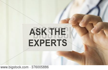 Closeup Doctor Hands Holding White Card Sign With Ask An Expert Text Message Isolated On Hospital Cl