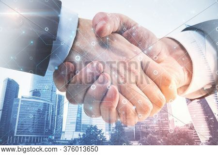Handshake With Circuit Chip Interface On Blurry City Backround. Teamwork And Deal Concept. Double Ex