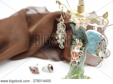 Beautiful Jewellery Close-up. Earrings, Neck Less And Rings On The Table. A Collection Of Jewelry. J