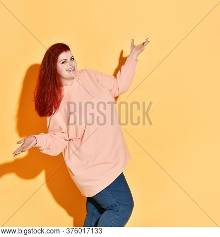 Excited Smiling Young Chubby Lady Is Happy Of Her Achievement, Showing Voila Gesture With Open Palms