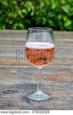 Tasting Of Dutch Rose Wine On Vineyard In Summer