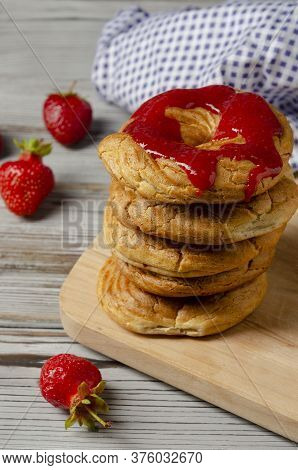 A Homemade Cruller Donuts With Strawberry Jam