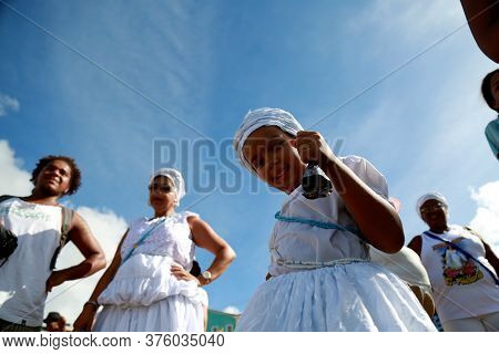 Salvador, Bahia / Brazil - February 2, 2015: Supporters Of Candomble Are Seen On The Rio Vermelho Be