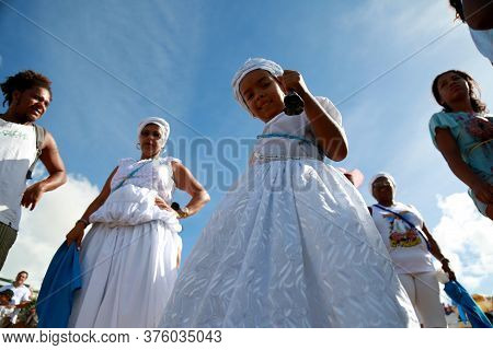 Salvador, Bahia / Brazil - February 2, 2015: Supporters Of Candomble Are Seen On The Rio Vermelho Be