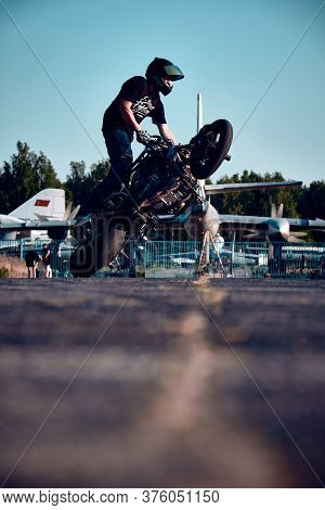 Moscow, Russia - 12 Jul 2020: Moto Rider Making A Stunt On His Motorbike. Stunt Motorcycle Rider Per