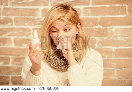 Clearing Up The Blockage. Pretty Girl With Runny Nose Holding Nasal Drops. Sick Woman Injecting Drop