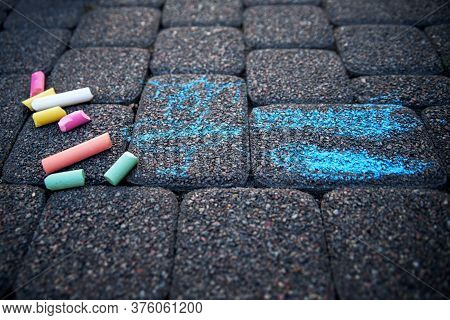 Childrens Scary And Terrible Chalk Drawing On The Pavement. The Concept Of Childrens Fears Of Nightm