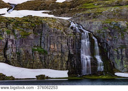 Mountain Lake Flotvatnet With Waterfall. Scenic Region Between Aurland And Laerdal In Norway. Nation