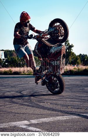 Moscow, Russia - 12 Jul 2020: Moto Rider Making A Stunt On His Motorbike. Stunt Motorcycle Rider Per