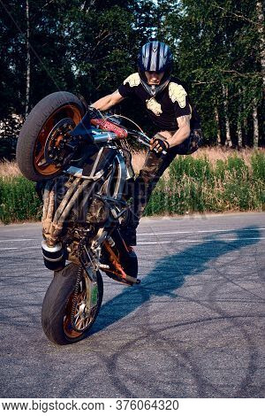 Moscow, Russia - 12 Jul 2020: Moto Rider Making A Stunt On His Motorbike. Stunt Motorcycle Rider Per