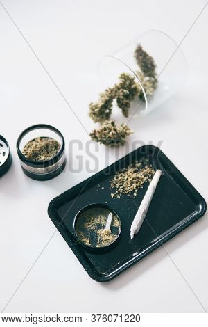Indica Sativa Medical Health. White Background. Kief In Grinder Close Up Vertical Shot. Grinder And 