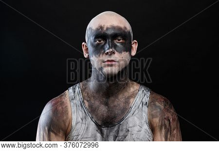 Photo Of Young Bald Mad Man With Dirty Make-up Effect