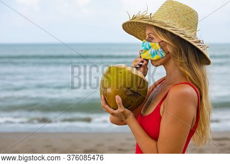 Funny Portrait Of Woman In Straw Hat Drinking Young Coconut On Tropical Sea Beach. New Rules To Wear