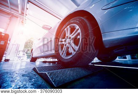 Automotive Suspension Test And Brake Test Rolls In A Auto Repair Service.