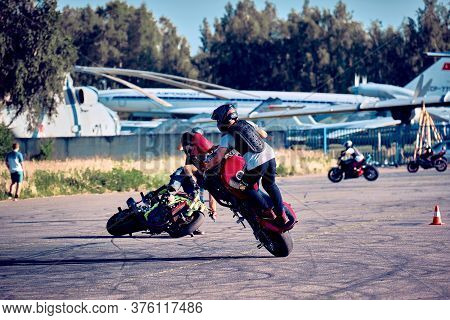 Moscow, Russia - 12 Jul 2020: Moto Rider Making A Stunt On His Motorbike. Stunt Motorcycle Rider Per