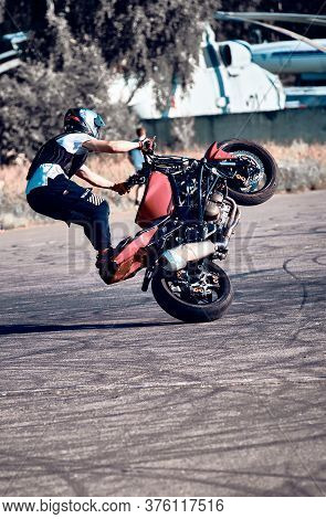 Moscow, Russia - 12 Jul 2020: Moto Rider Making A Stunt On His Motorbike. Stunt Motorcycle Rider Per