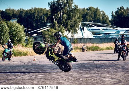 Moscow, Russia - 12 Jul 2020: Moto Rider Making A Stunt On His Motorbike. Stunt Motorcycle Rider Per