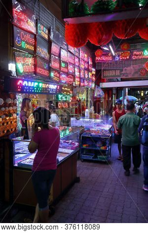 Manila, Philippines - November 25, 2017: People Visit A Neon Store Chinatown In Manila, Philippines.