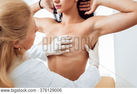 Doctor Get Examining Breast Of Young Woman. Consultation With Gynecologist.