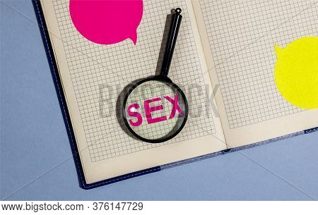 Word Sex On Table Throgh Magnifier Glass