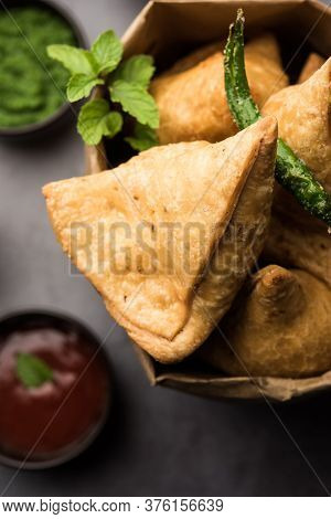 Samosa snack Is An Indian Deep Fried Pastry With A Spiced Filling Usually Made With Potatoes, Spices