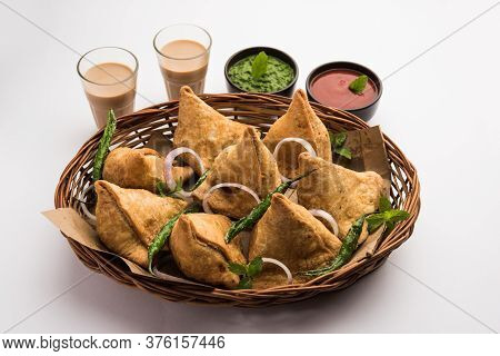 Samosa snack Is An Indian Deep Fried Pastry With A Spiced Filling Usually Made With Potatoes, Spices