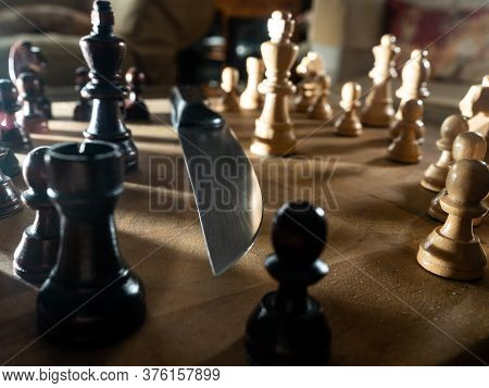 Chess Pieces And Knife