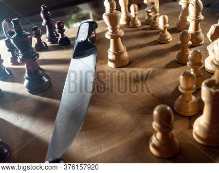 Chess Pieces And Knife