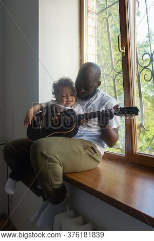 The Dad Plays Guitar To Son Song, Afro Amercans