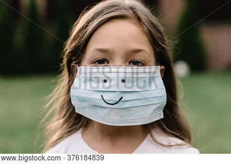 The Medical Mask On Children's Face. Happy Medical Mask.