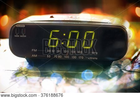 Black Digital Alarm Radio Clock. Alarm Radio Clock Indicating Time To Wake Up. Digital Clock Display