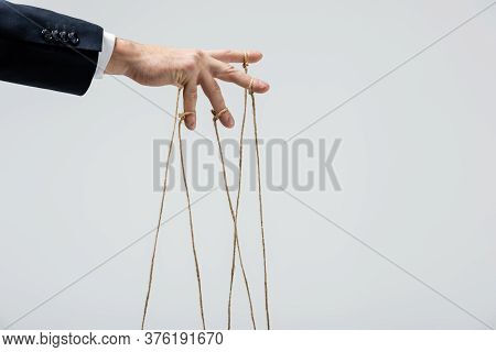 Partial View Of Puppeteer With Strings On Fingers Isolated On Grey