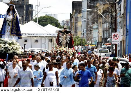 Salvador, Bahia / Brazil - January 1, 2016: Member Of The Catholic Church Carry Images Of Bom Jesus 