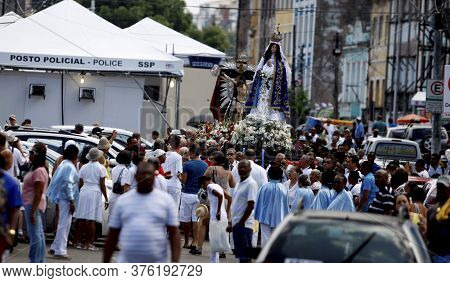 Salvador, Bahia / Brazil - January 1, 2016: Member Of The Catholic Church Carry Images Of Bom Jesus 